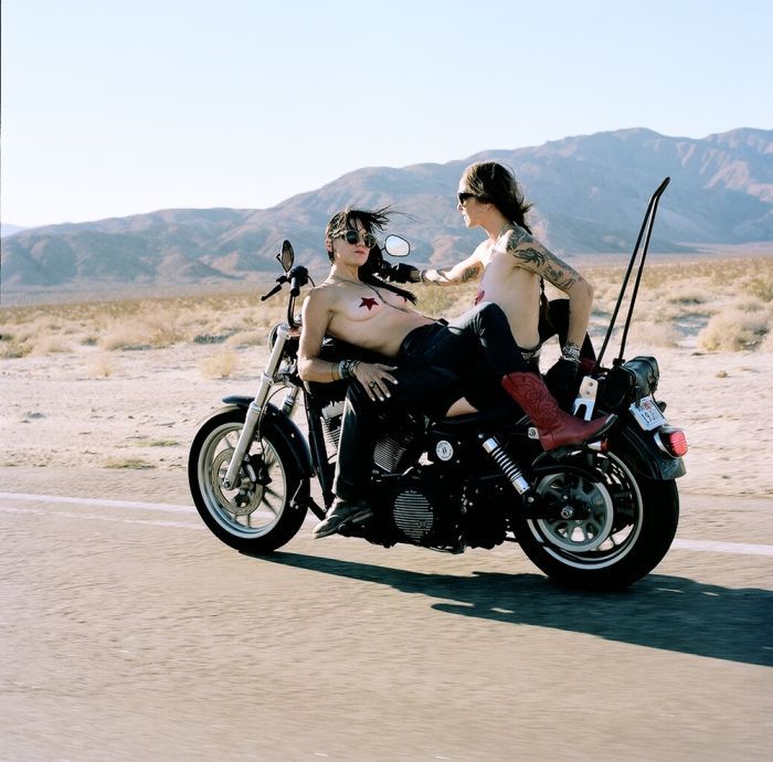 Girls on a motorcycle in Soyapango